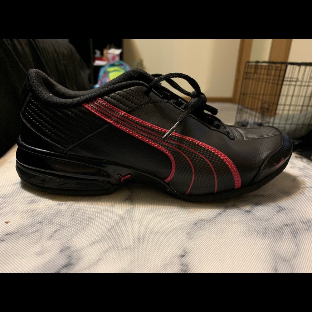Black and pink Puma tennis shoes